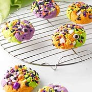 Three color hocus pocus cookies on a cooling rack.