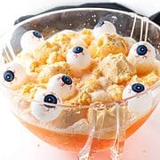 Orange punch in bowl with eyeballs.