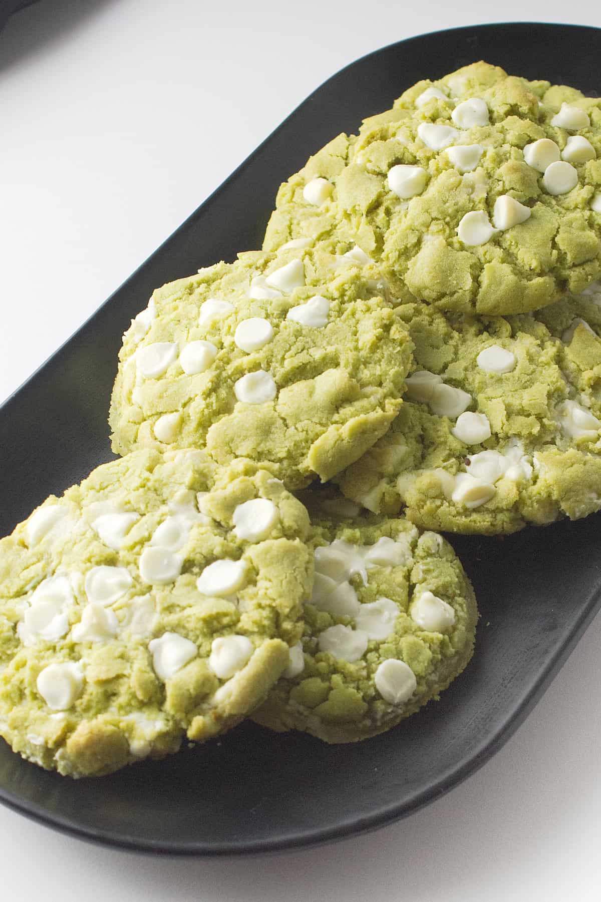 Platter or green matcha tea cookies with white chocolate chips.