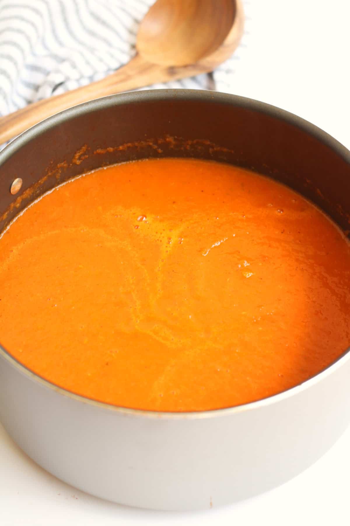 Dutch oven with tomato soup.