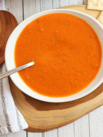 bowl and pot of copycat Panera tomato soup.
