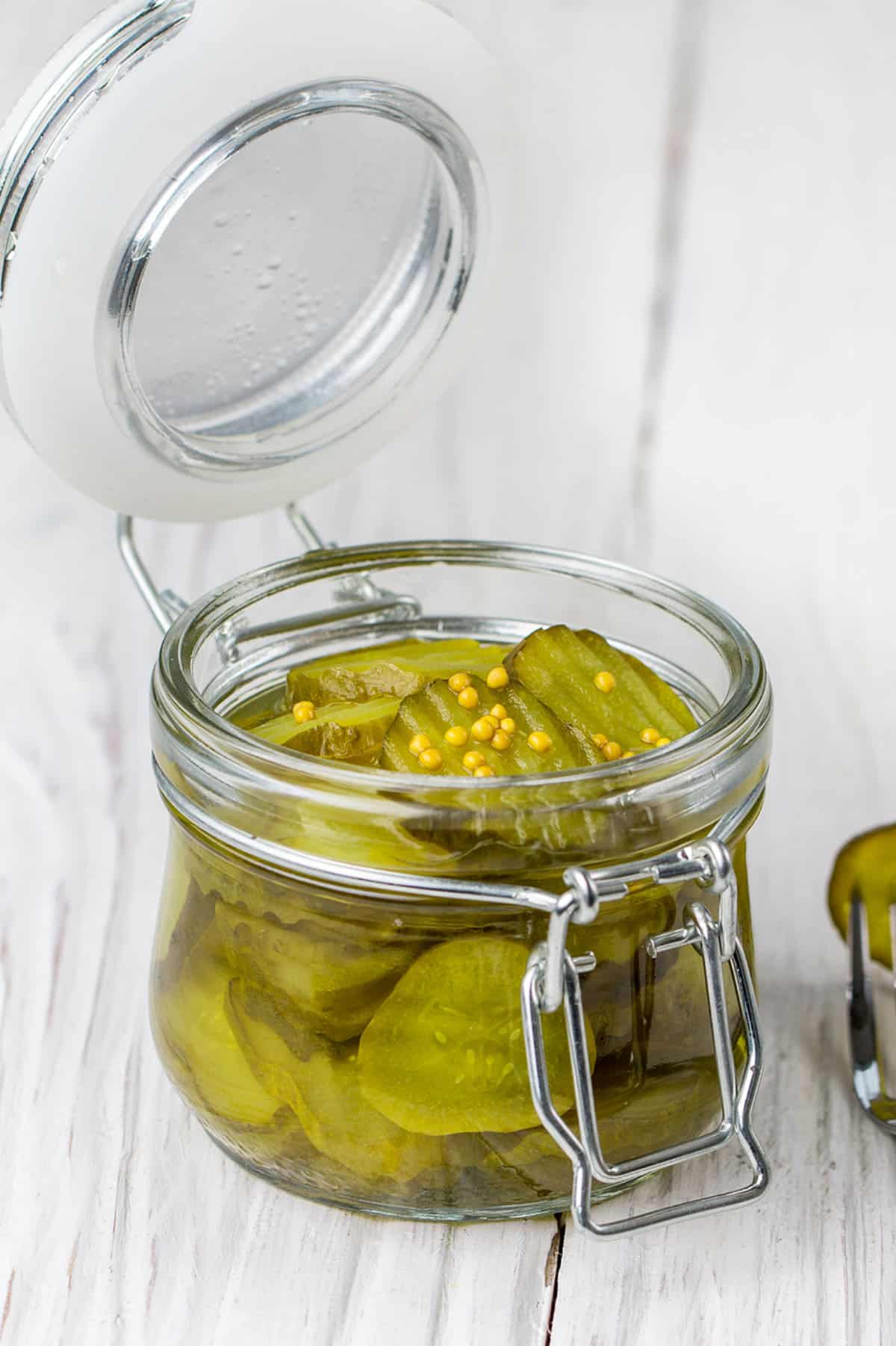 a bail jar full of bread and butter pickles.