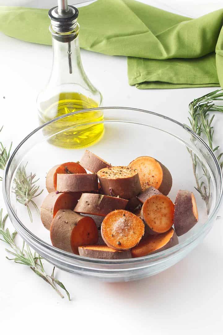 seasoned sweet potatoes in a bowl.