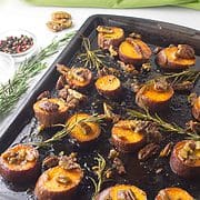 baked sweet potatoes slices with pecans.