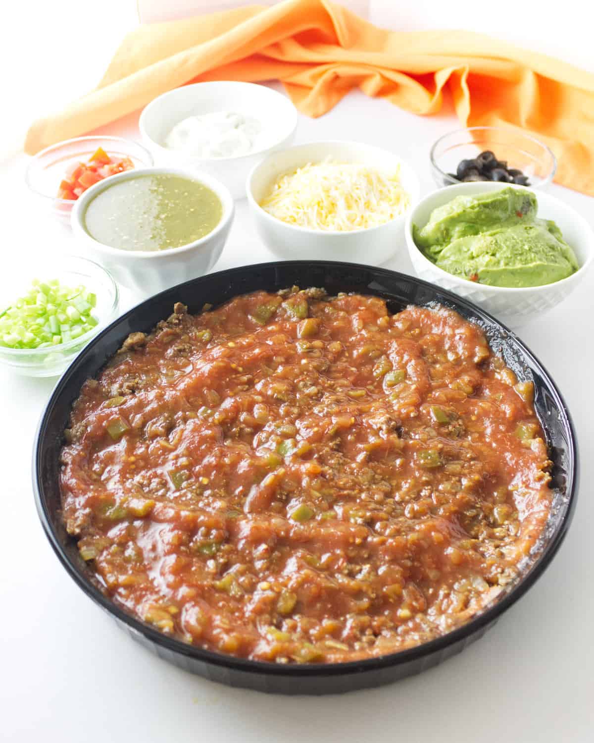 salsa spread out in a dish.