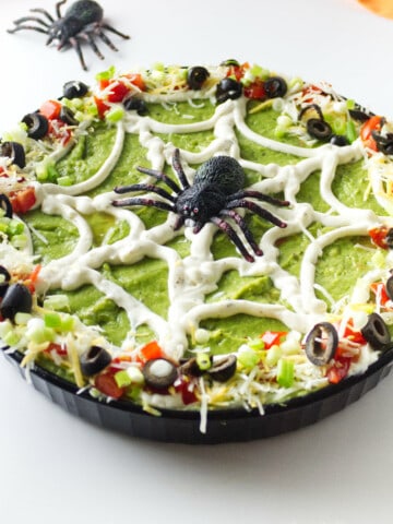 Spider web 7 layer dip with plastic spider.