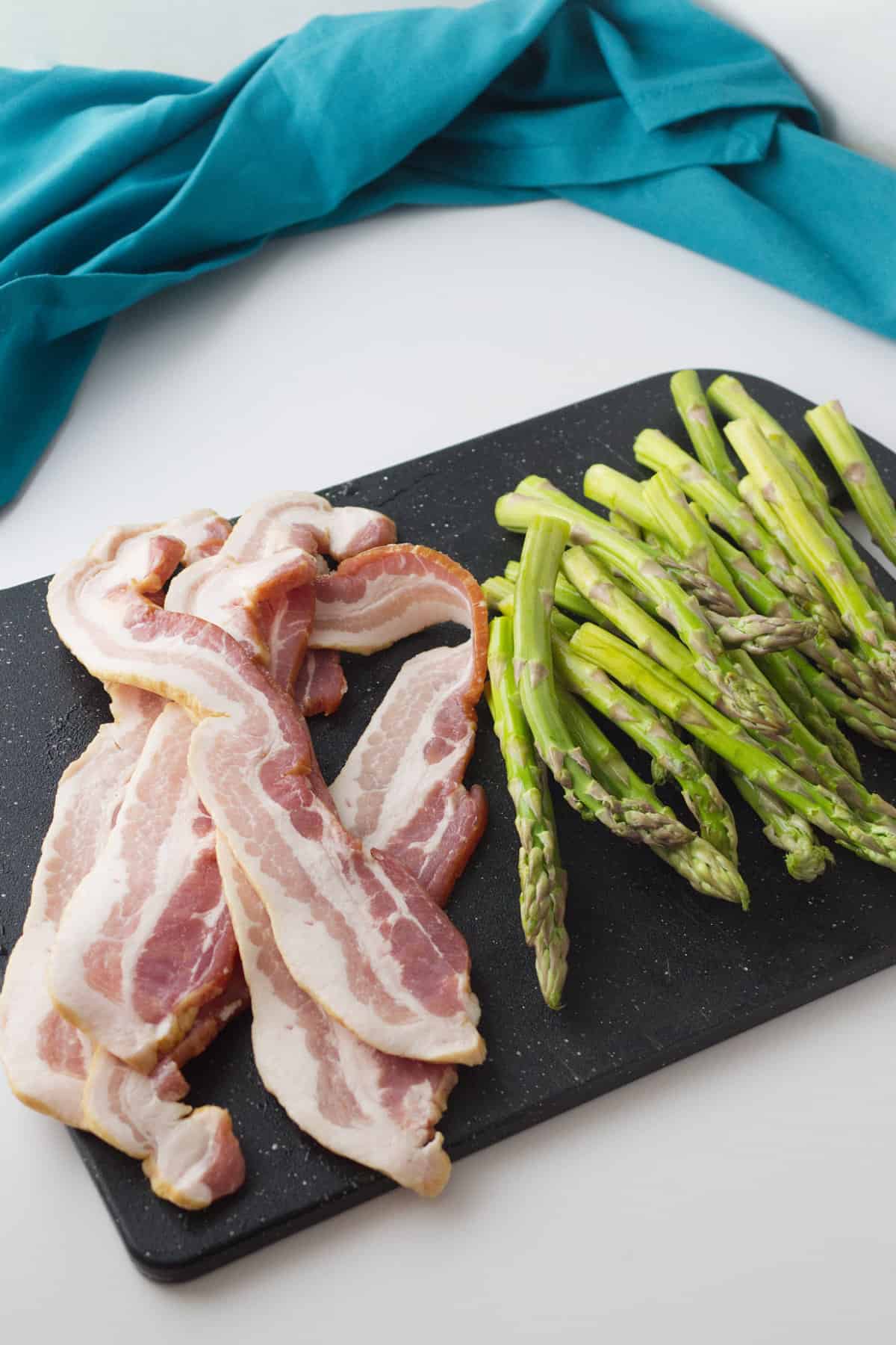 strips of bacon and spears of asparagus.
