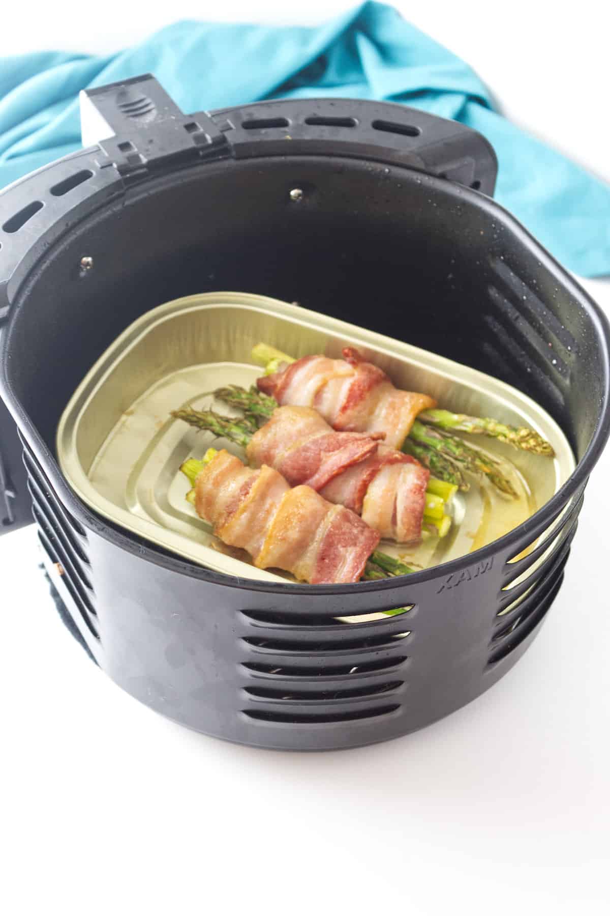 cooked bundles of bacon wrapped asparagus.