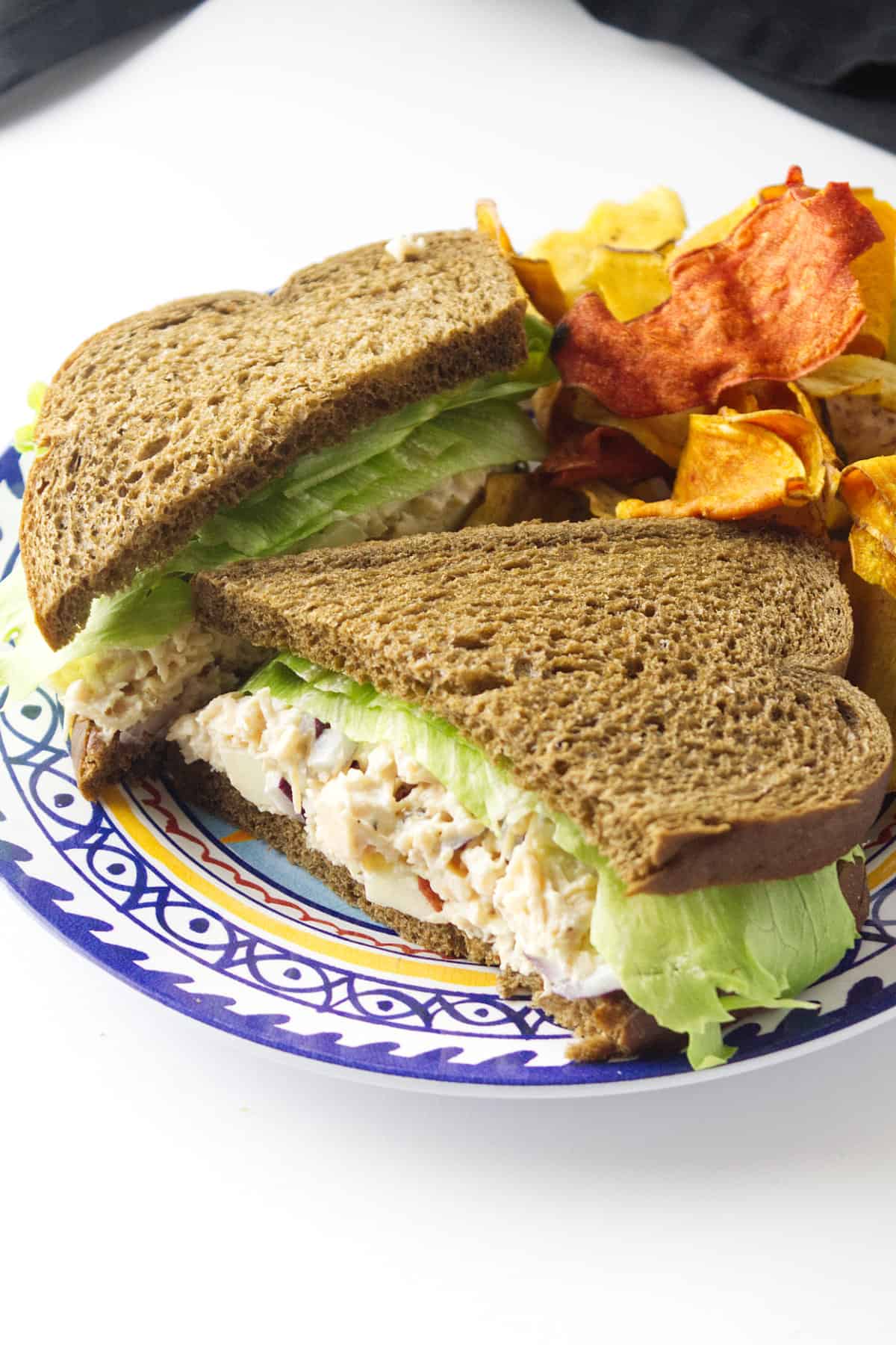 chicken salad without celery sandwich on a plate.