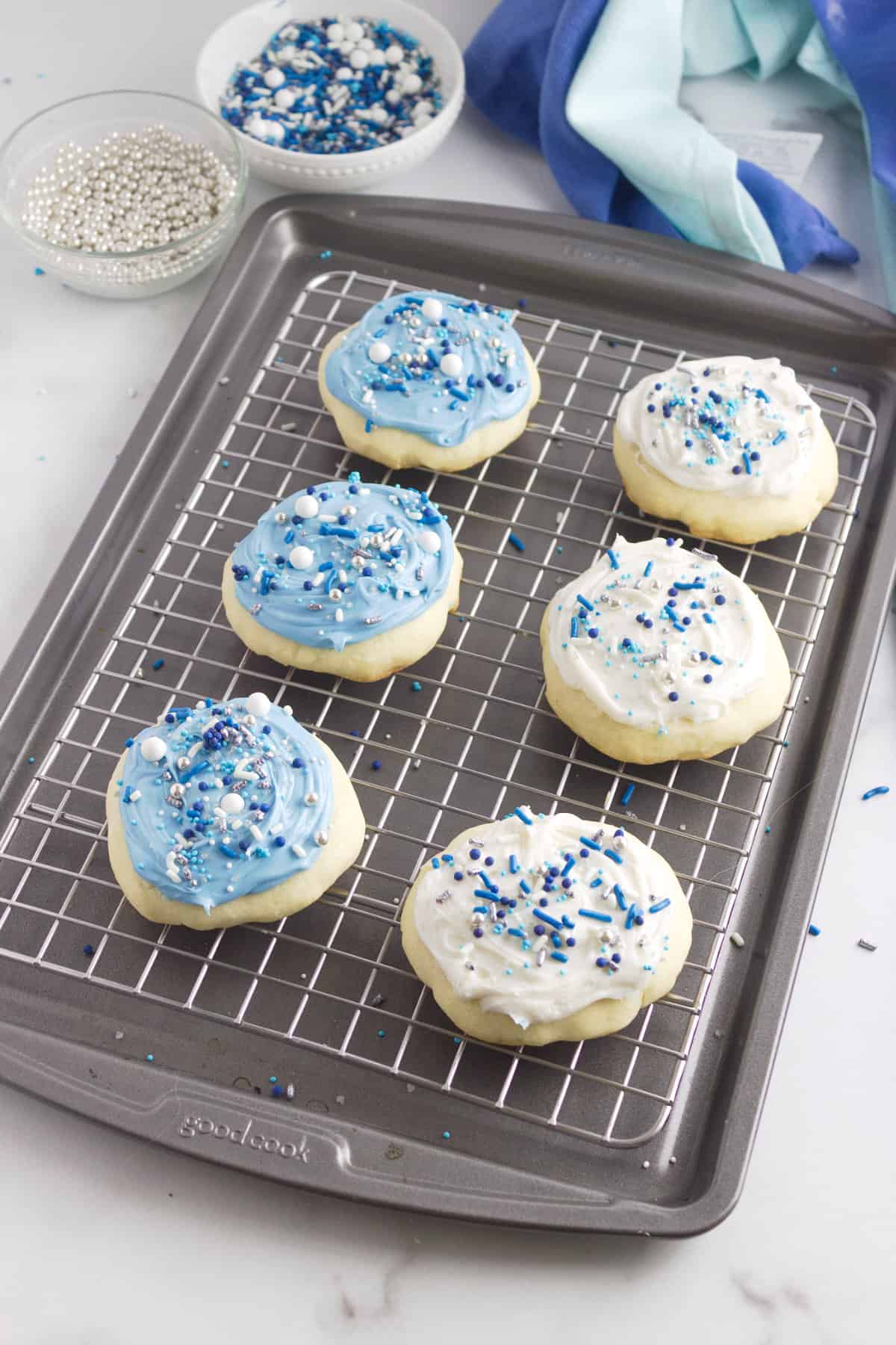 tray of decorated frosted vanilla cookies.