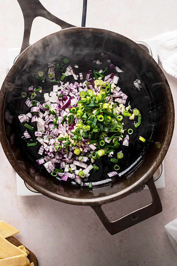 onions and scallions in a skillet.