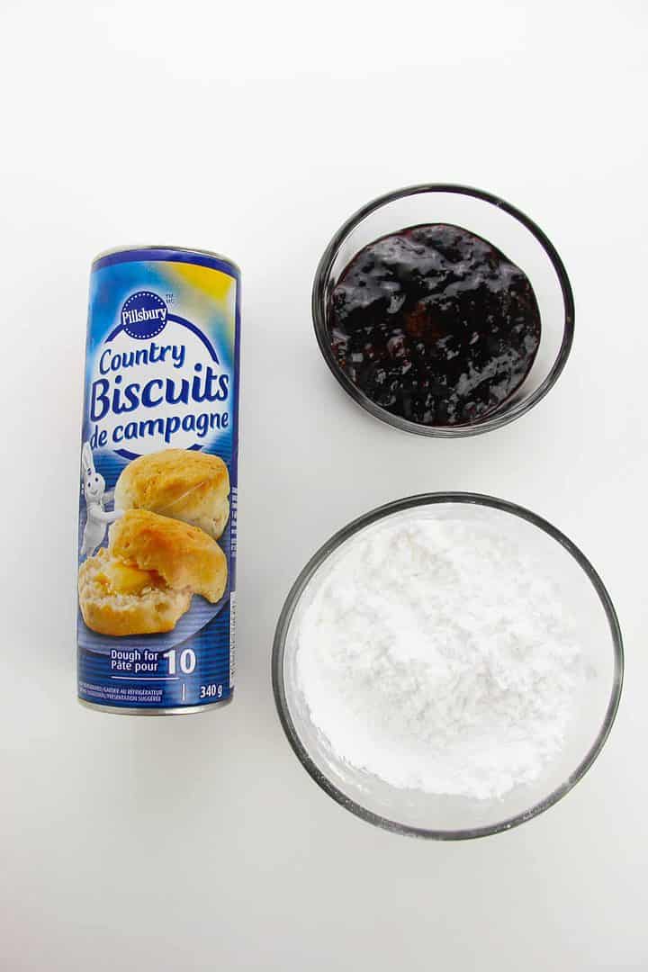ingredients photo of biscuit dough, powdered sugar, and jelly.