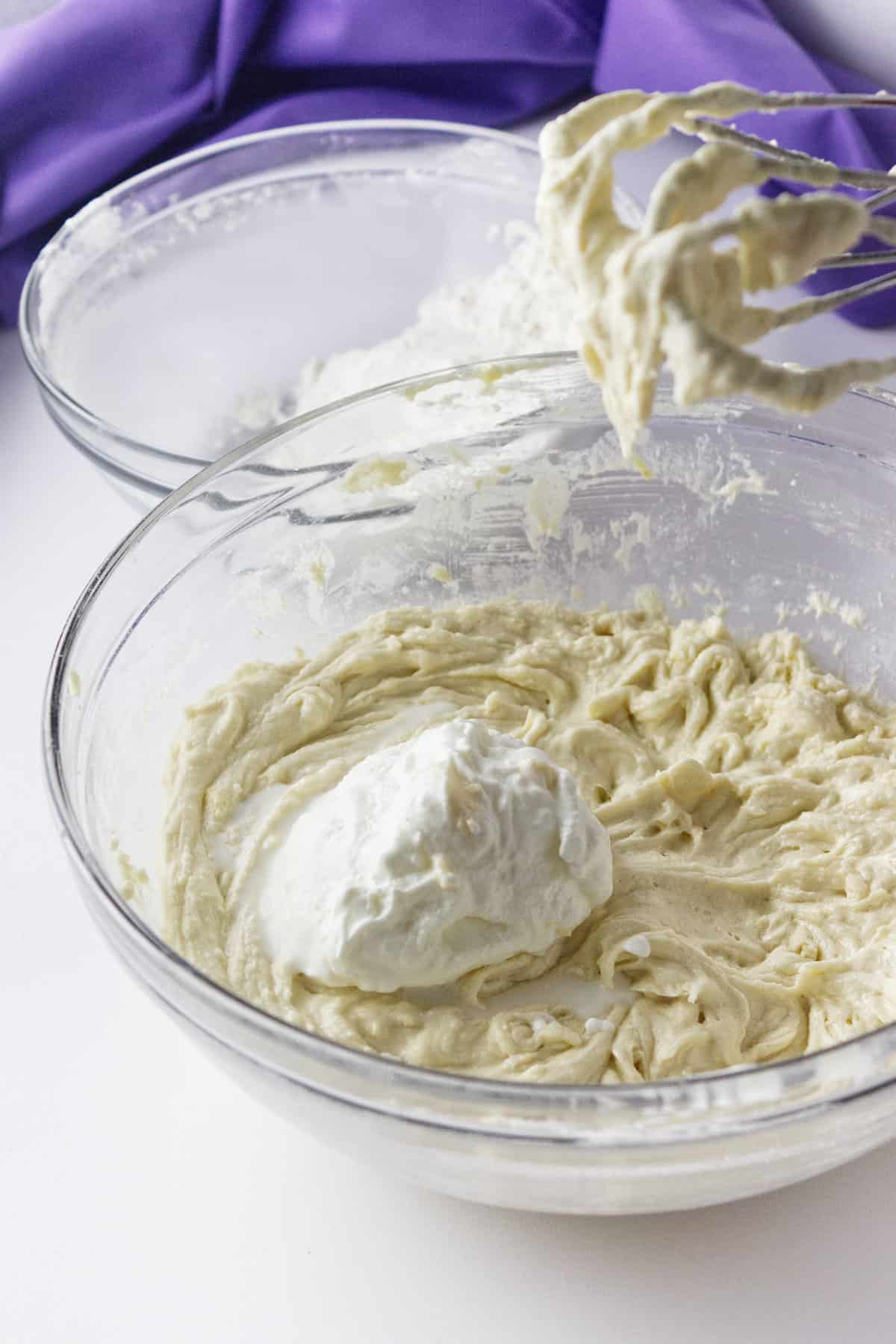 batter being mixed with sour cream.