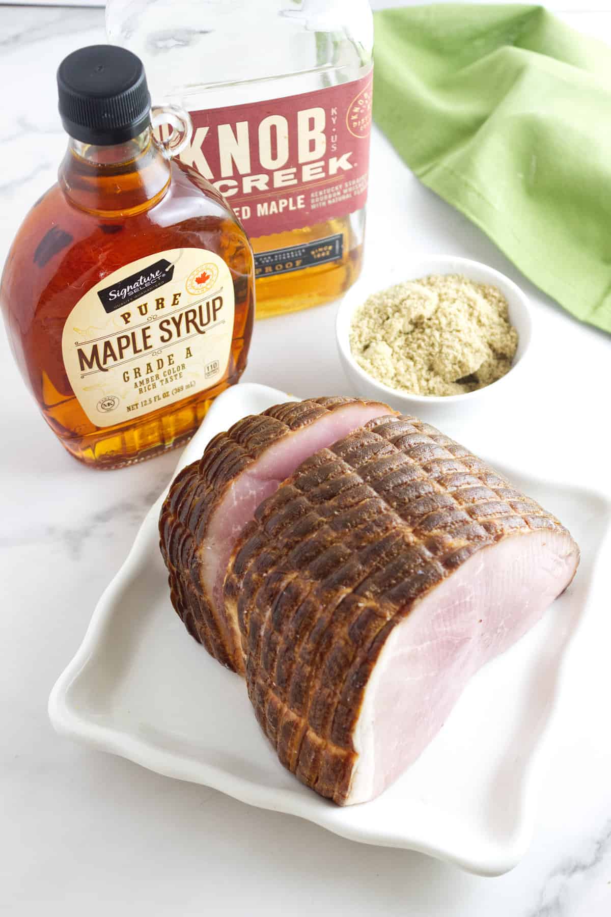 ingredients for making a maple bourbon glazed ham.