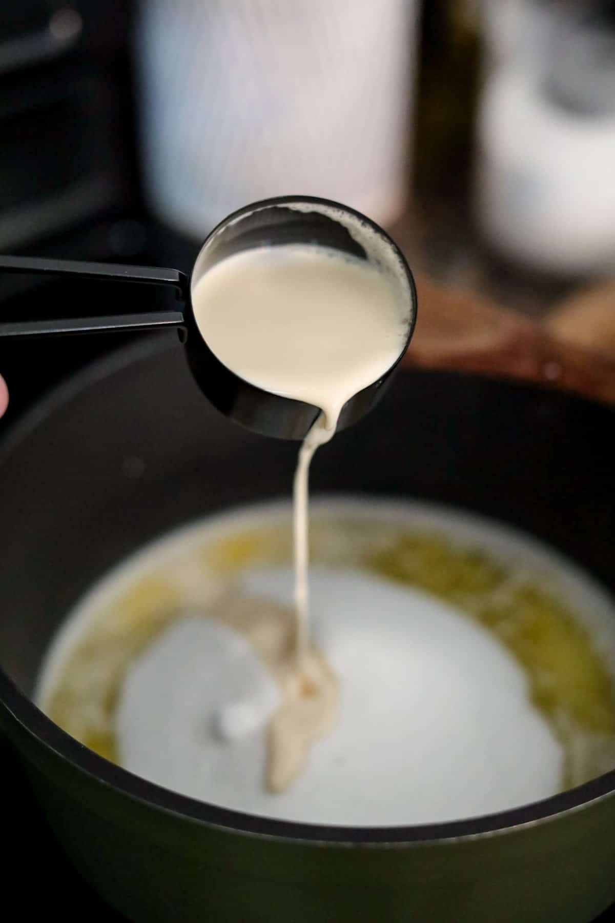 milk added to pot of sugar and butter.