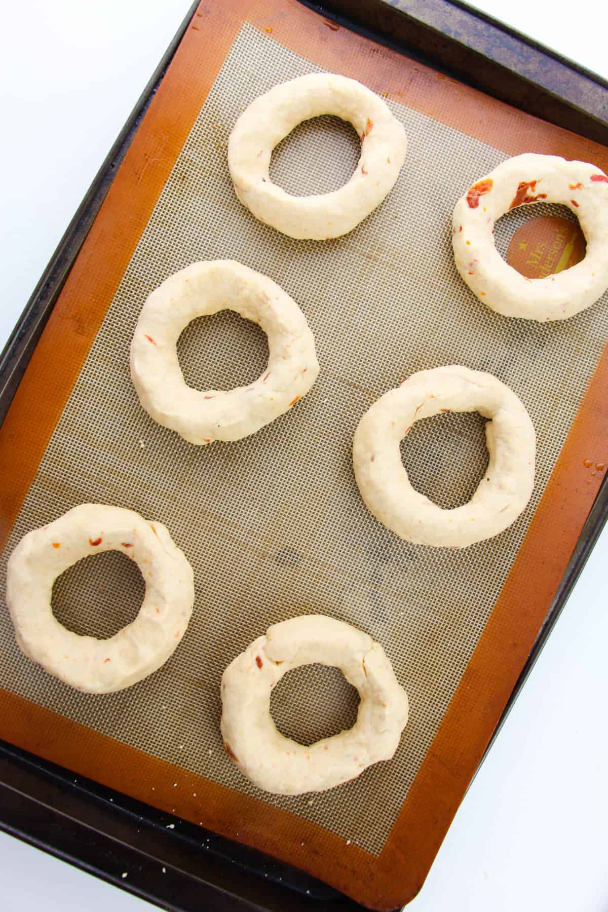 dough shaped into bagels.