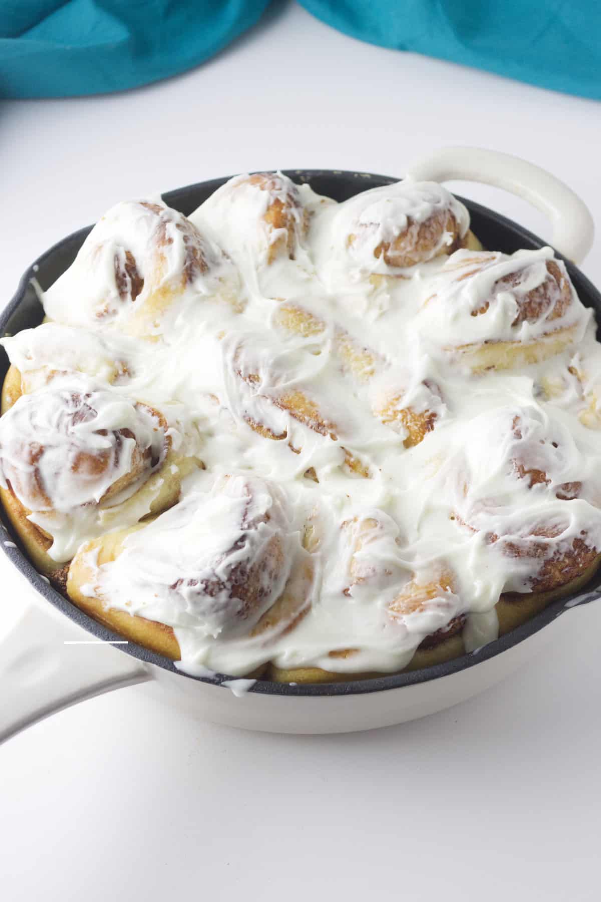 pan of frosted cinnamon rolls.