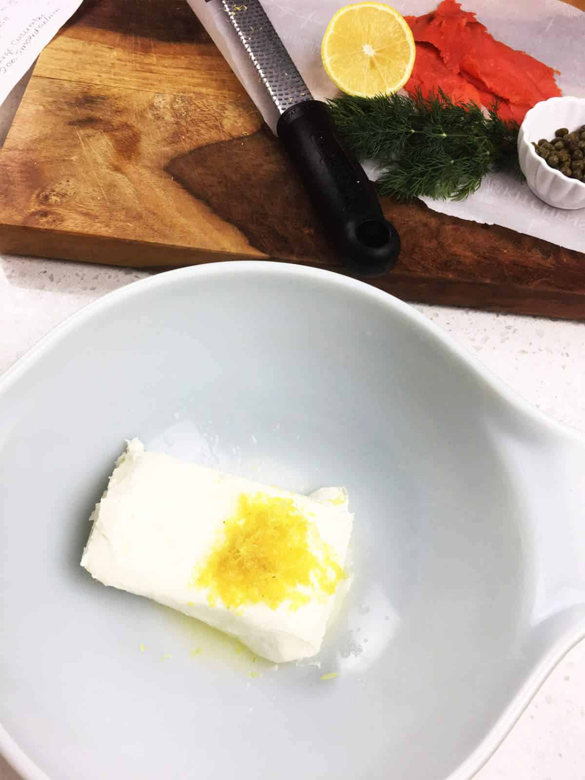 cream cheese and lemon zest in a bowl.