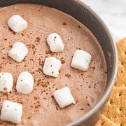 hot cocoa dip with mini marshmallows and graham crackers.
