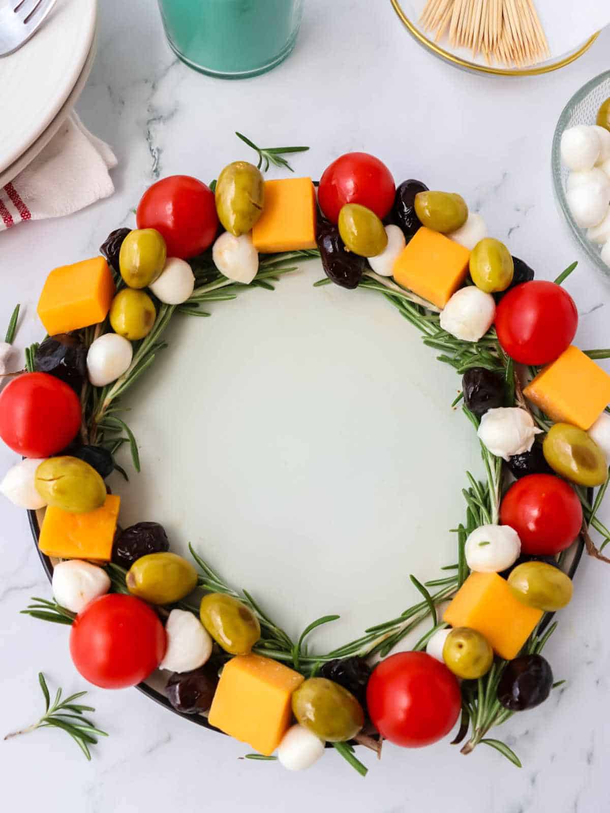 green olives added to holiday appetizer wreath.