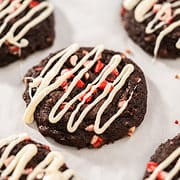 drizzled icing on cookies with candy cane garnish.