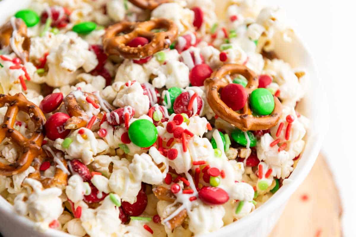 white bowl full of Christmas gourmet popcorn.