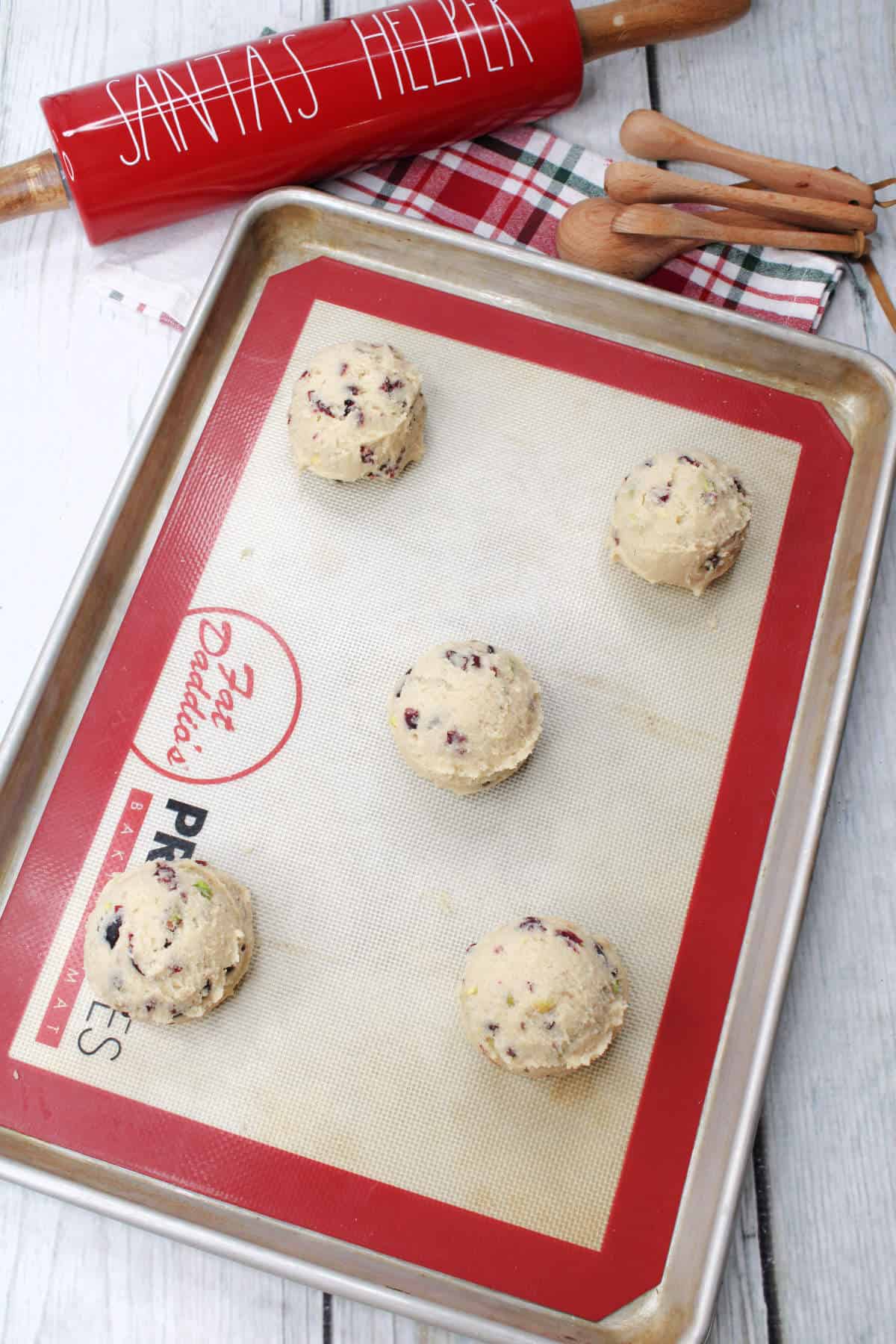 cookie scoops on a baking sheet.