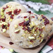 shortbread cookies with pistachios and cranberries on plaid napkin.