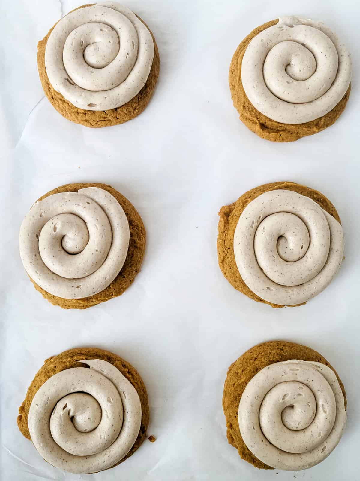 iconic frosting swirls on pumpkin spice cookies.