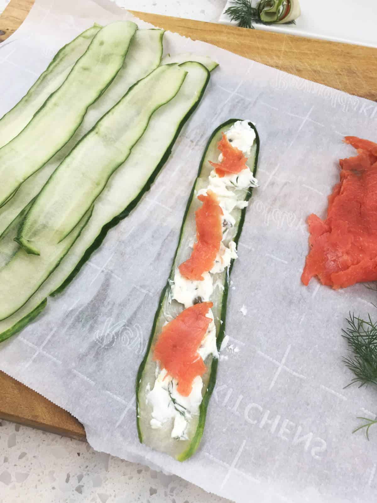 cream cheese and smoked salmon spread on ribbons of cucumber.