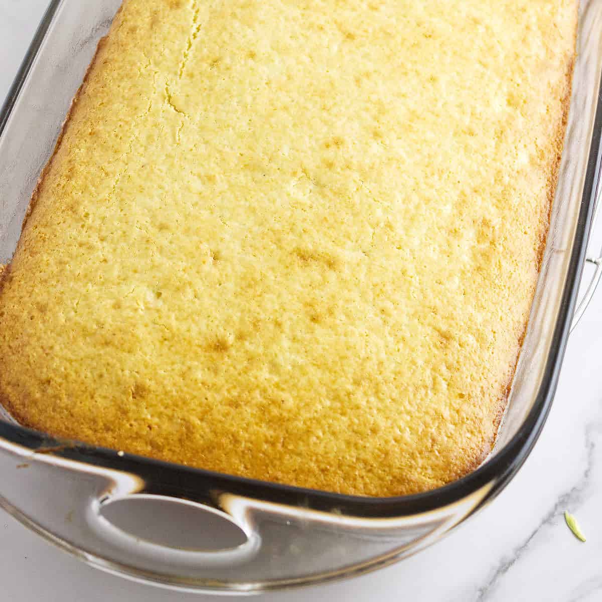 baked cornbread in 9 x 13 pan cooling.