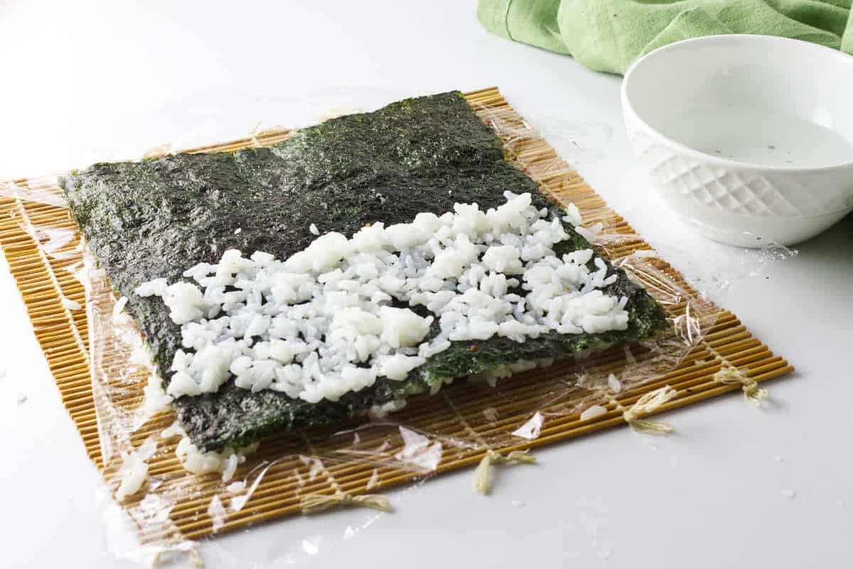 Very thin layer of rice on other side of seaweed sheet.