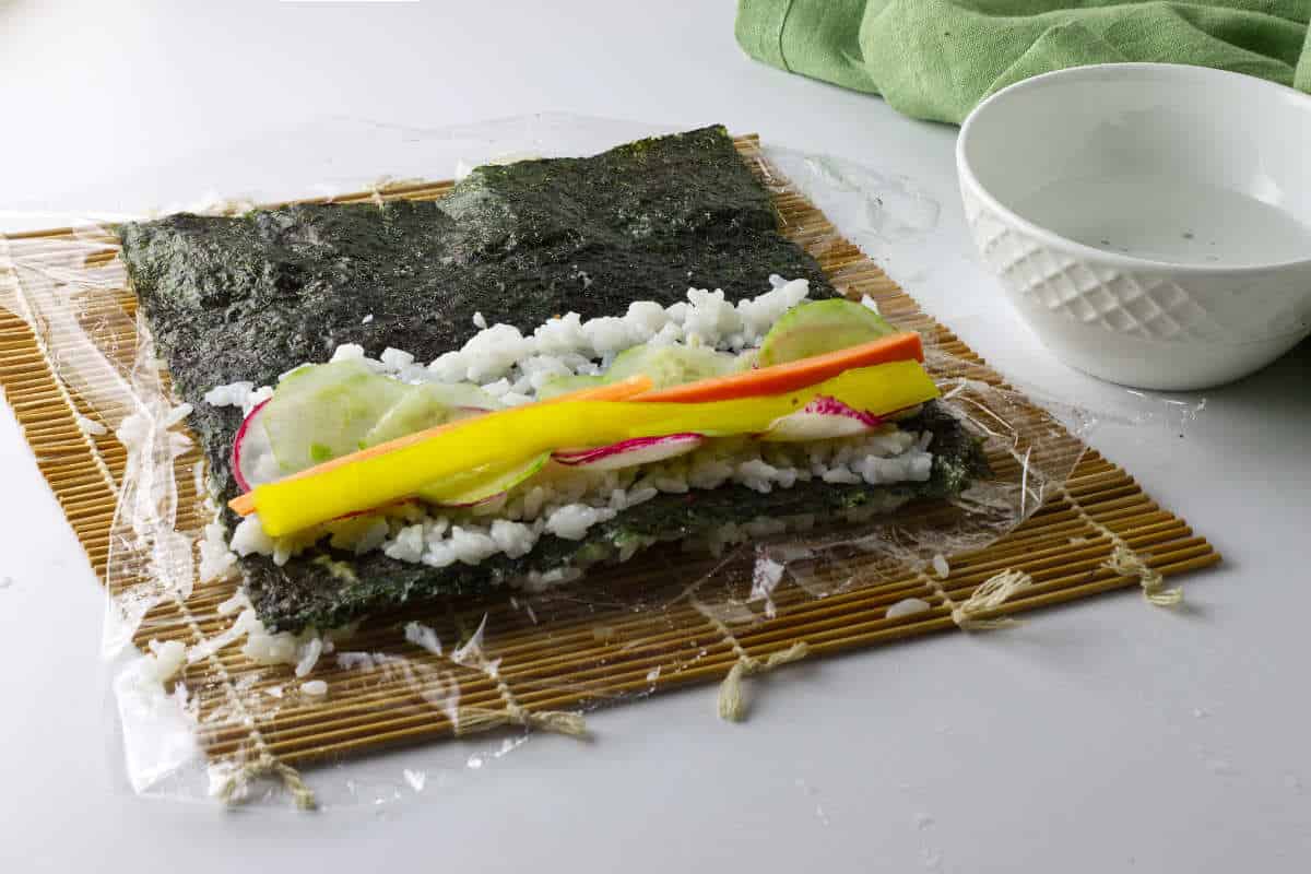 kimbap vegetables placed on rice.