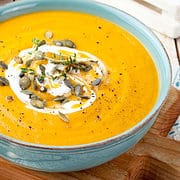 Paneras Autumn Squash soup with pepitas and sour cream swirl in a bowl.