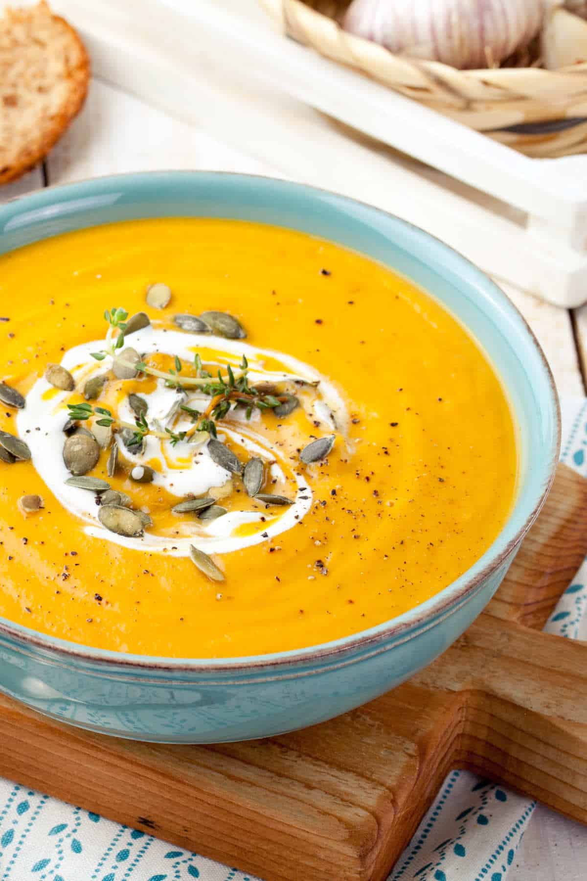 Paneras Autumn Squash soup with pepitas and sour cream swirl in a bowl.