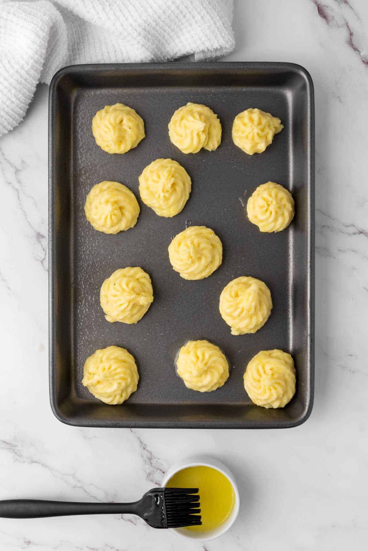 potato puffs on a tray for baking.