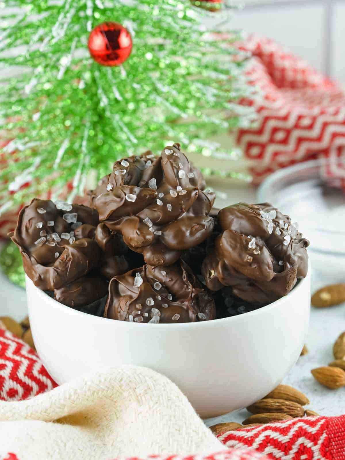 A Holiday bowl of chocolate almond clusters.