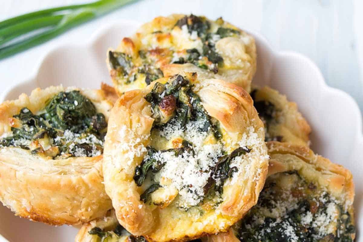 puff pastry tarts filled with spinach and feta cheese.