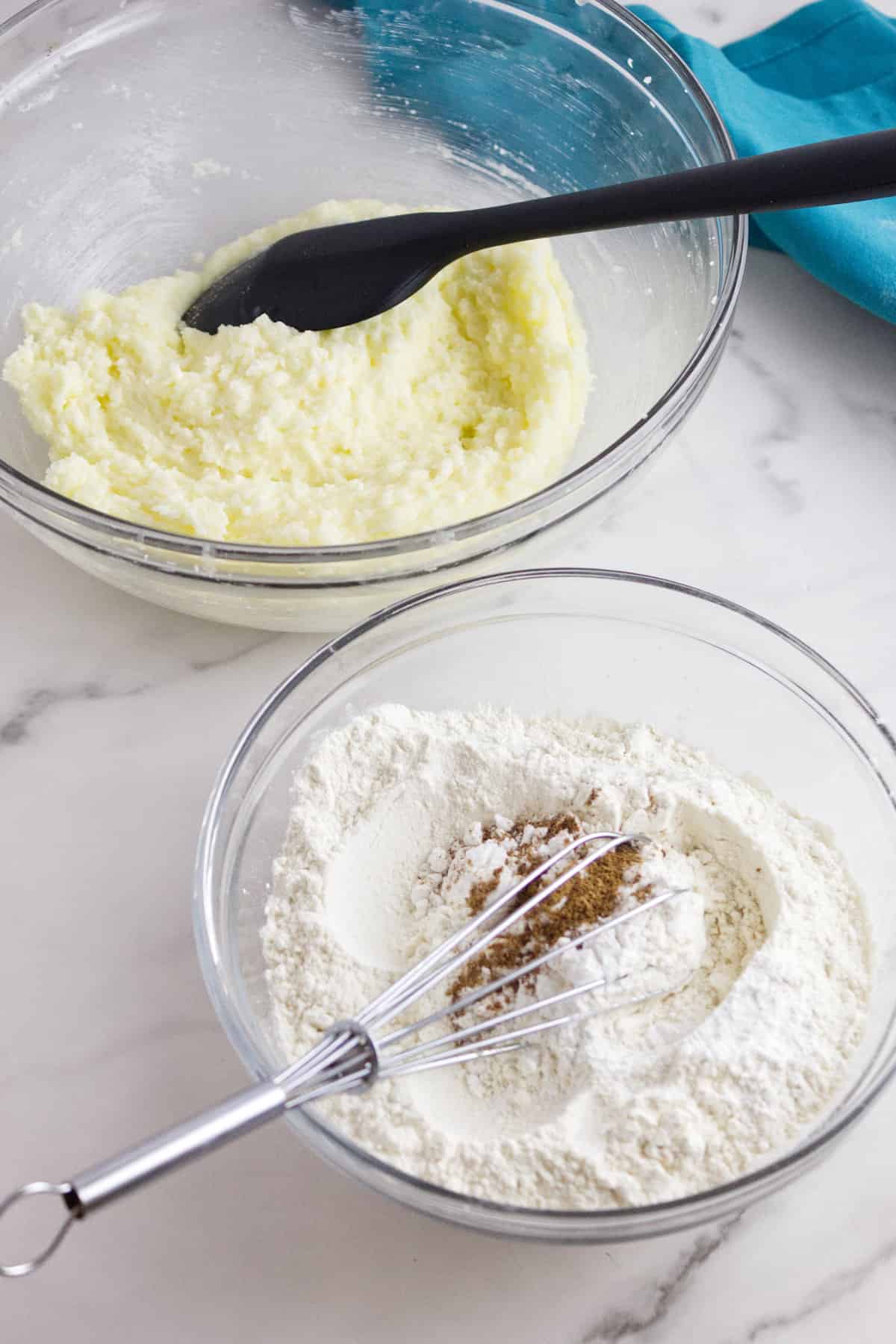 creamed sugar and butter in a bowl and flour ingredients in a second bowl.