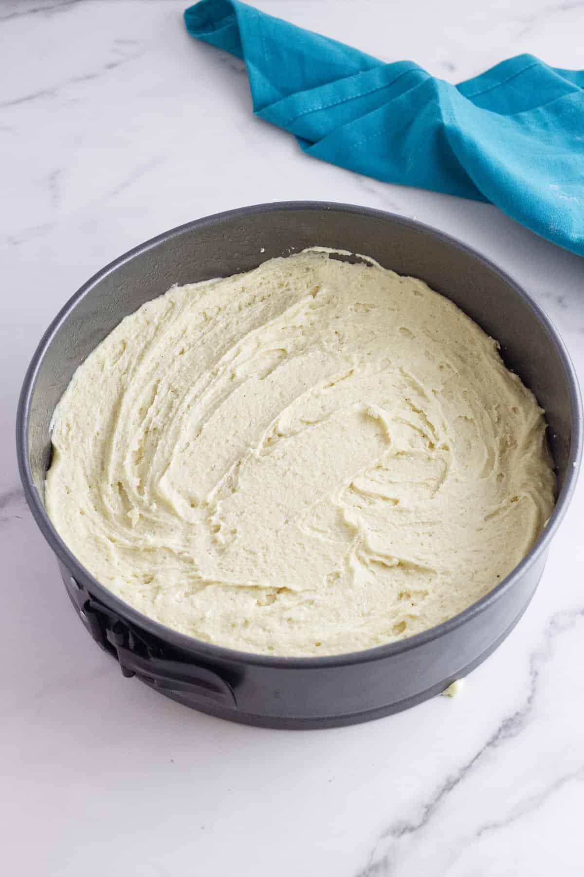 cake batter spread evenly in a pan.