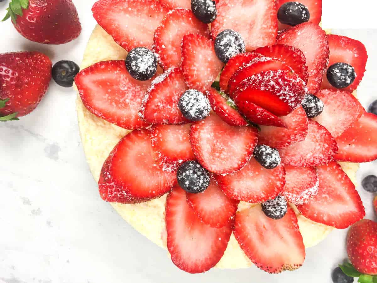Keto Strawberry Cheesecake with sliced strawberries on top as decoration.