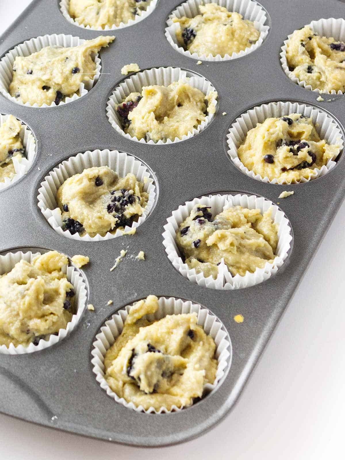 muffin batter added to muffin pan.