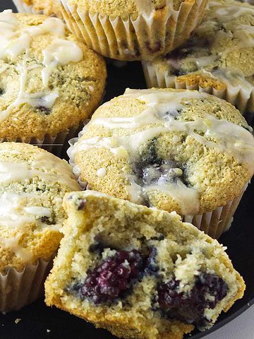 platter of fresh baked blackberry muffins.