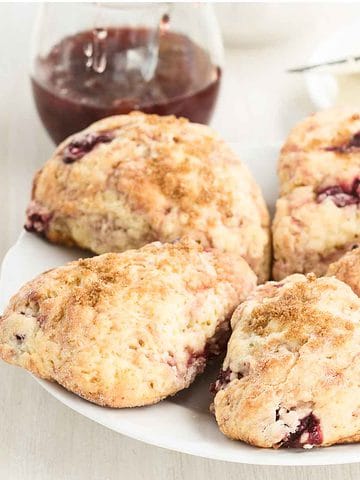 Traditional Irish cream scones with cherries, served with butter and preserves.