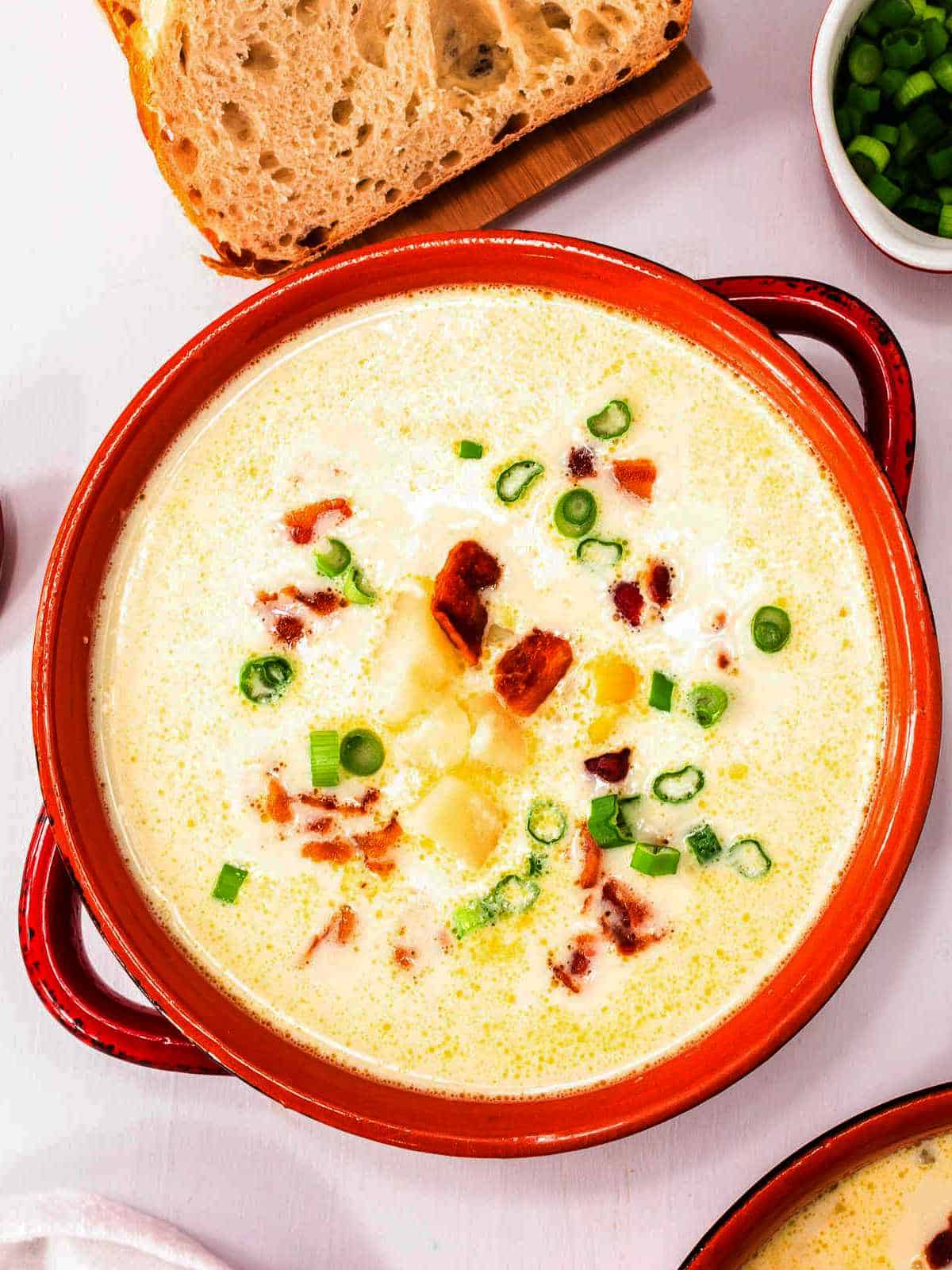 soup with tomatoes, potatoes, corn, and cream.