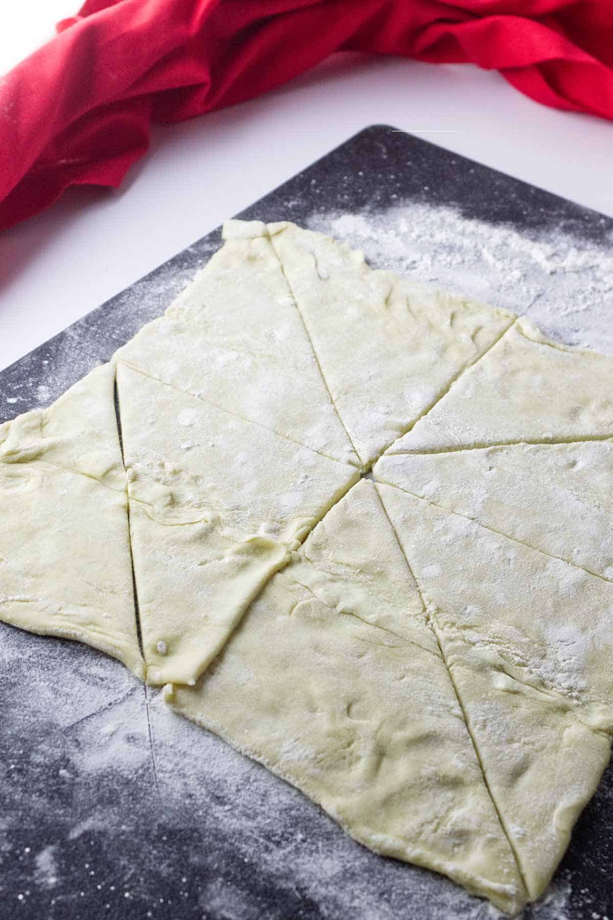 puff pastry divided into triangles.