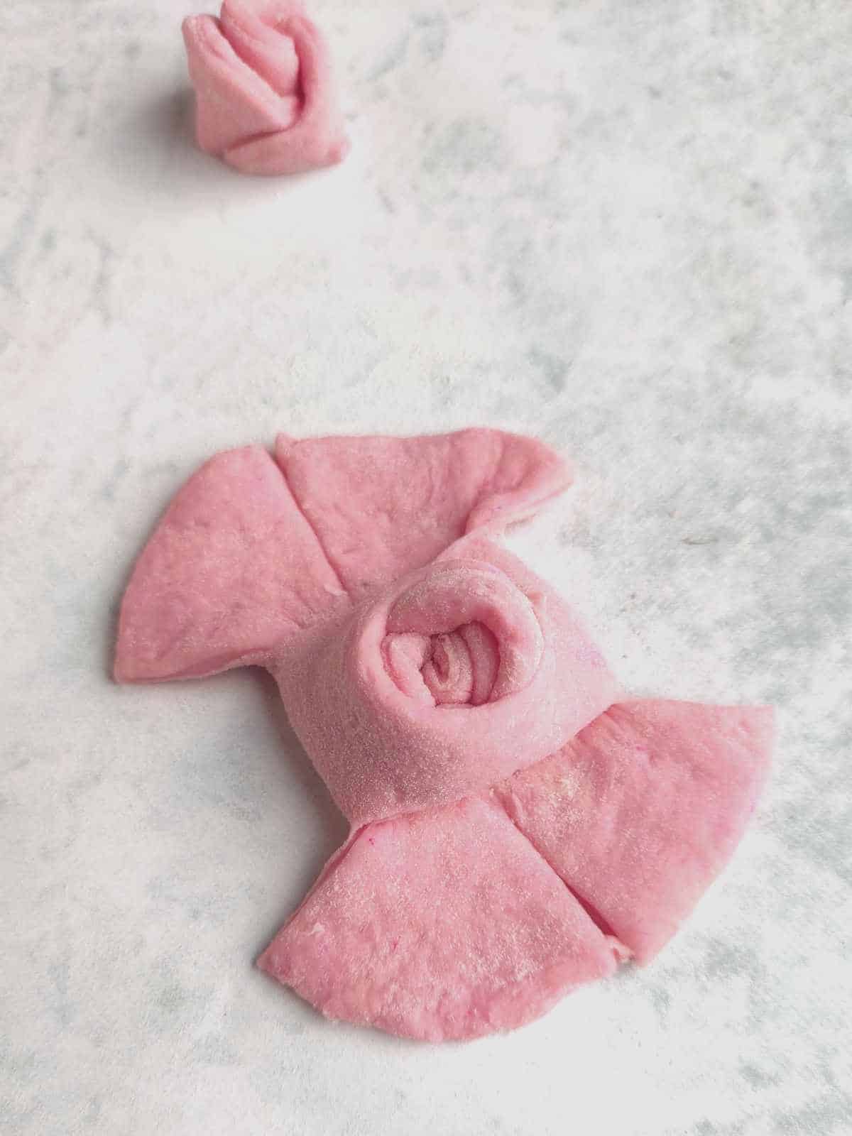 Pink mantou buns dough for shaping outer petals of dough rose bud.