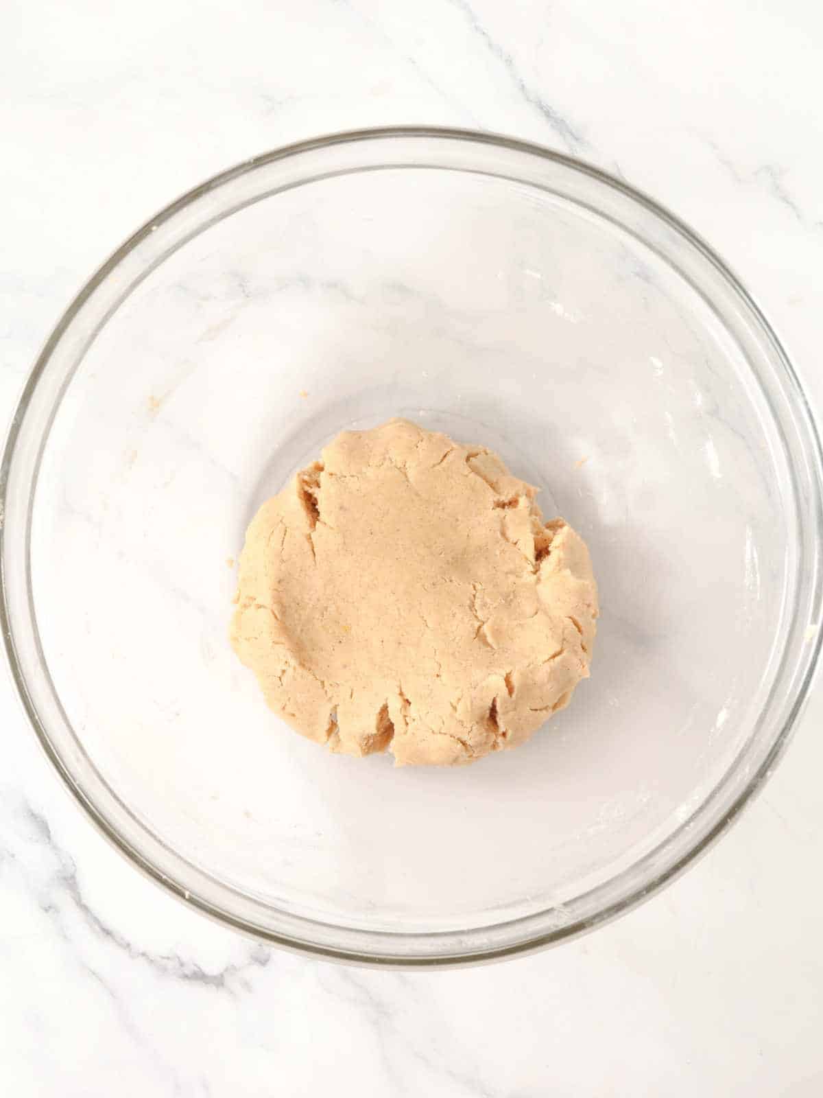 Prepared shortbread cookie dough in a bowl ready to be rolled out for cutting.