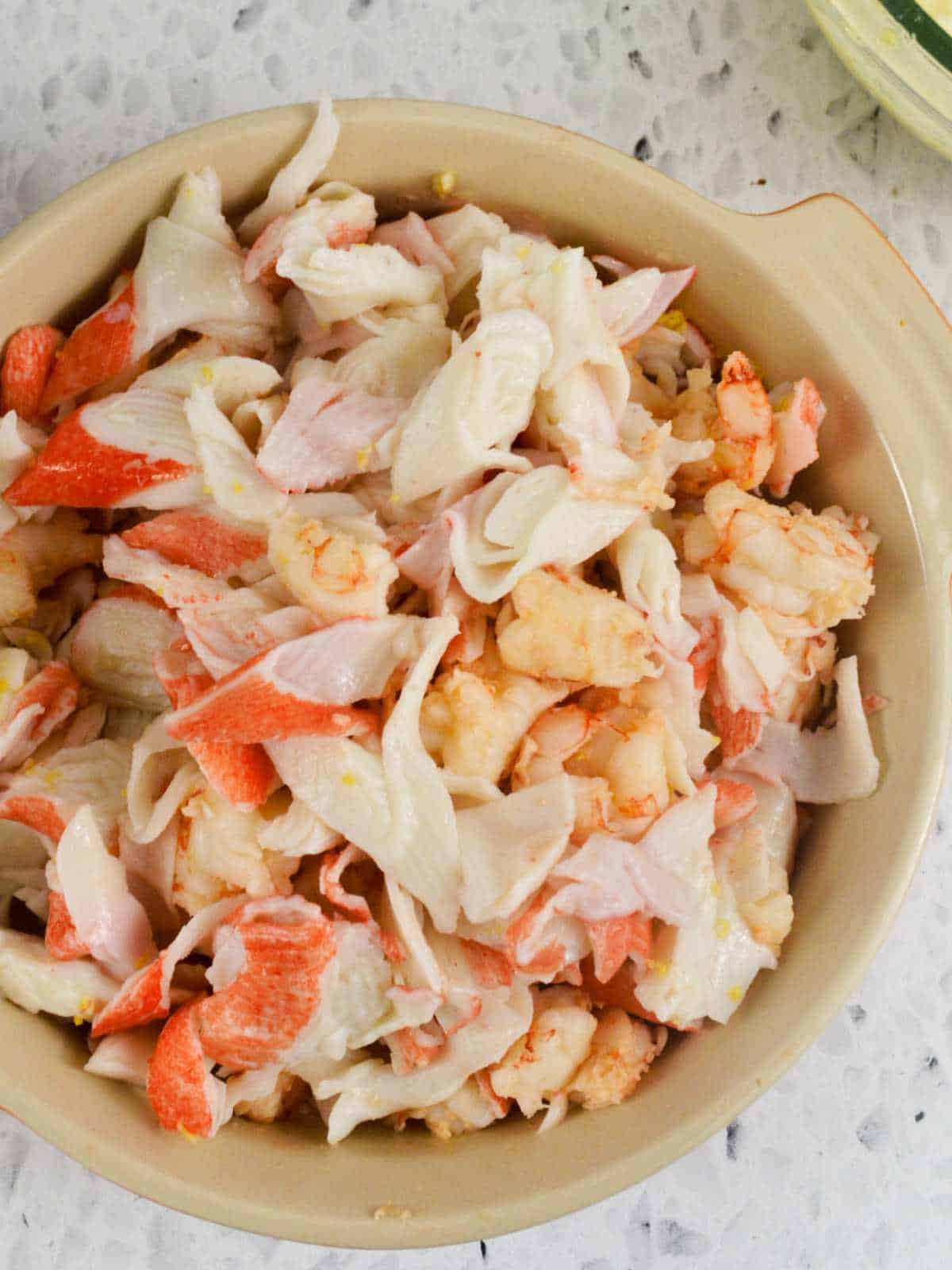 cooked crab and shrimp meat in a bowl.