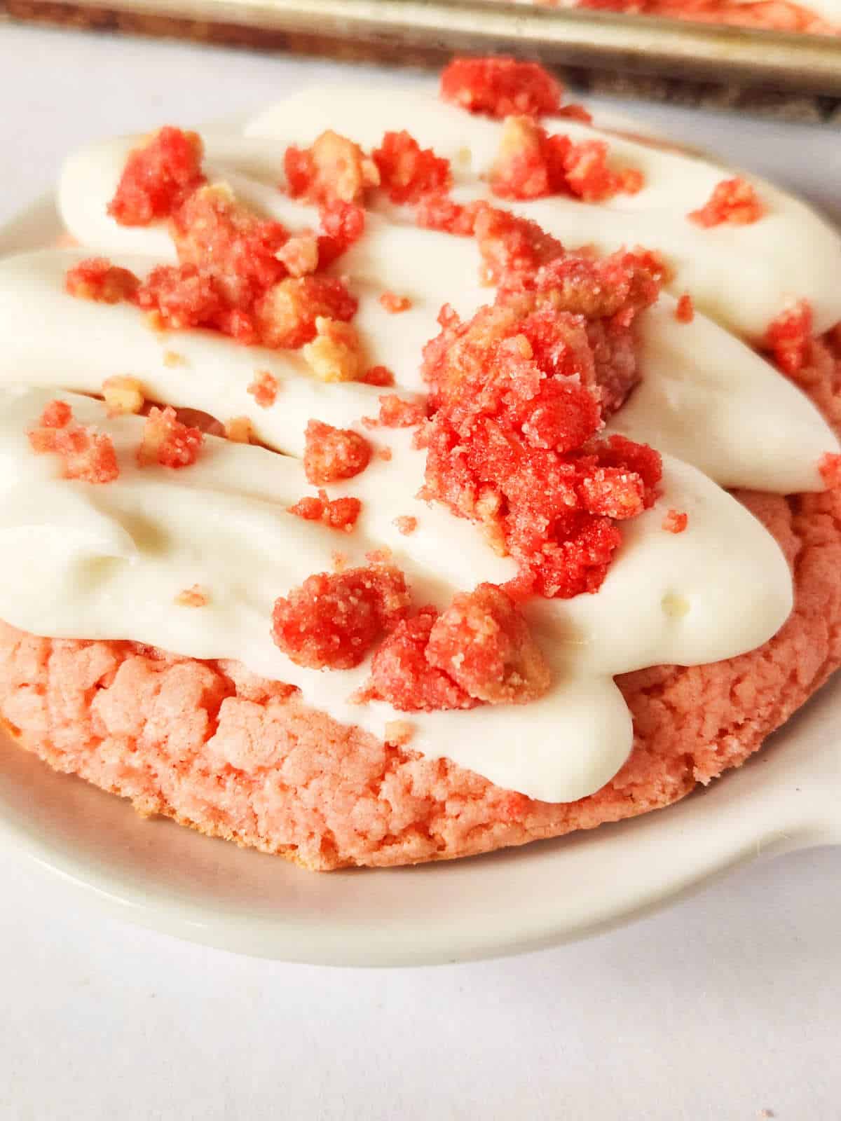strawberry crunch cookie on a small plate.